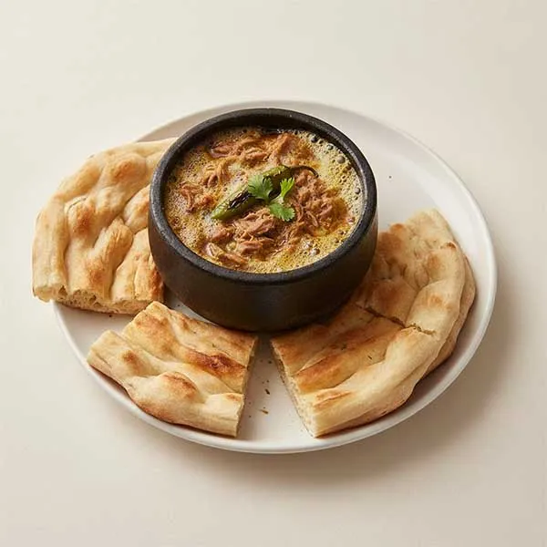 Yemeni Lamb Fahsa with Stone-Baked Mulawah Bread & Spicy Sahawiq